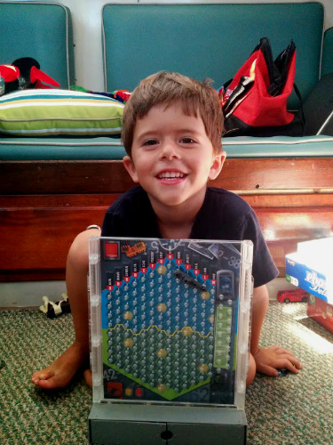 Some games come in more travel friendly shapes and sizes. This is our Battleship game.