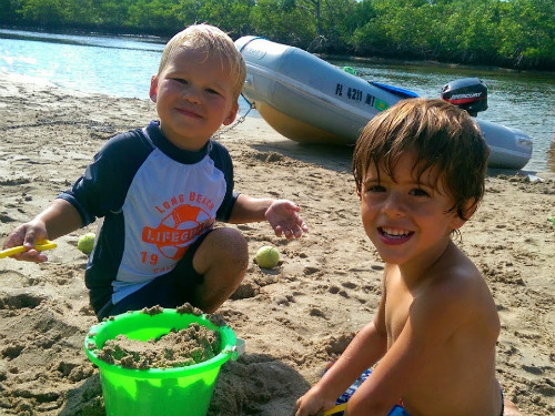 Ethan and Carter making castles on the beach.