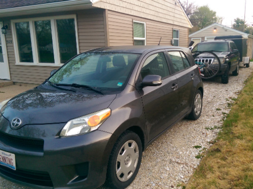 Our two cars and trailer in the driveway