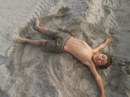 We don't have snow, but there's nothing wrong with a sand angel on Christmas day instead!